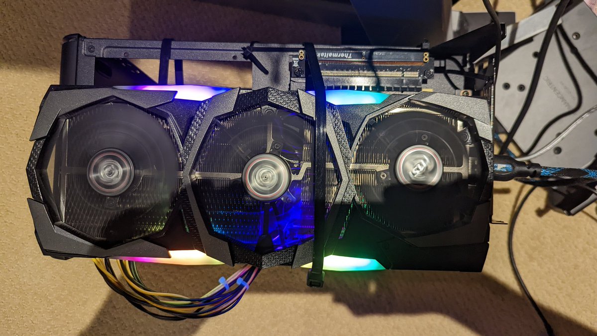 leonowski's tweet photo. "My GPU doesn't fit in the EGPU enclosure."

"Fine, mount the GPU externally on the EGPU enclosure."

It's not stupid if it works.  Also, zip ties and a spare PCIE riser cable are always handy.  :) https://t.co/ViR2ZEAME8