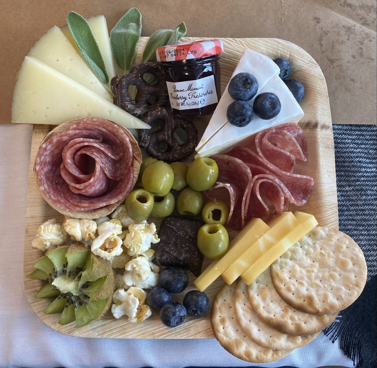 rhoworld's tweet photo. Rho team members joined CEO Laura Helms Reece for an afternoon curating personalized charcuterie boards at our Boards & Bites event. We cannot brie-lieve all the beautiful creations! Special thanks to Kayte Fry for leading a wonderful class. 🧀💐 #LifeAtRho https://t.co/Qqx5bBBAyT