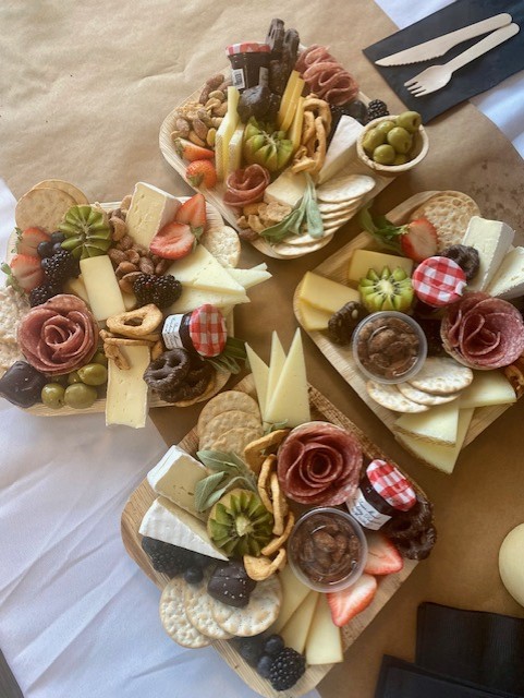 rhoworld's tweet photo. Rho team members joined CEO Laura Helms Reece for an afternoon curating personalized charcuterie boards at our Boards & Bites event. We cannot brie-lieve all the beautiful creations! Special thanks to Kayte Fry for leading a wonderful class. 🧀💐 #LifeAtRho https://t.co/Qqx5bBBAyT