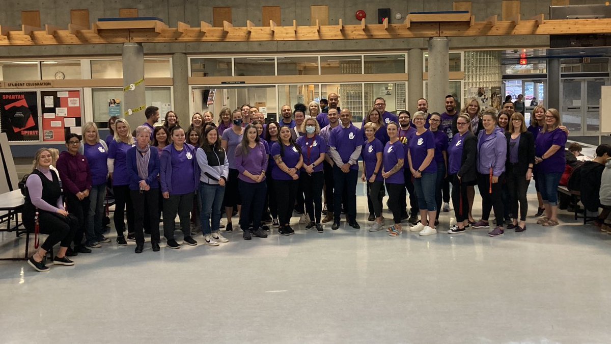 MsRacanelli's tweet photo. Today is Spirit Day! Wonderful to see staff in their purple attire today! 💜 So proud of our Spartans who designed our windows. All. The. Love. @NorthSurreySec @Surrey_Schools #spiritday2022 https://t.co/GG9kE2IwS8
