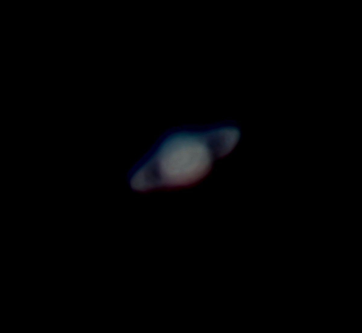Saturn 30 minutes ago from my telescope. Not bad for a cloudy-ish night.