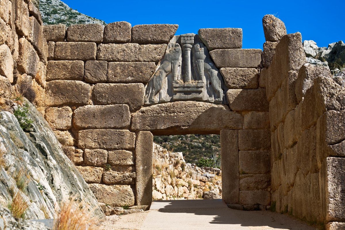 The Lion Gate was the main entrance of the Bronze Age citadel of Mycenae, southern Greece. It was erected during the 13th century BC, around 1.250 BC in the northwest side of the acropolis. Photographer: WitR / Stock Photo.