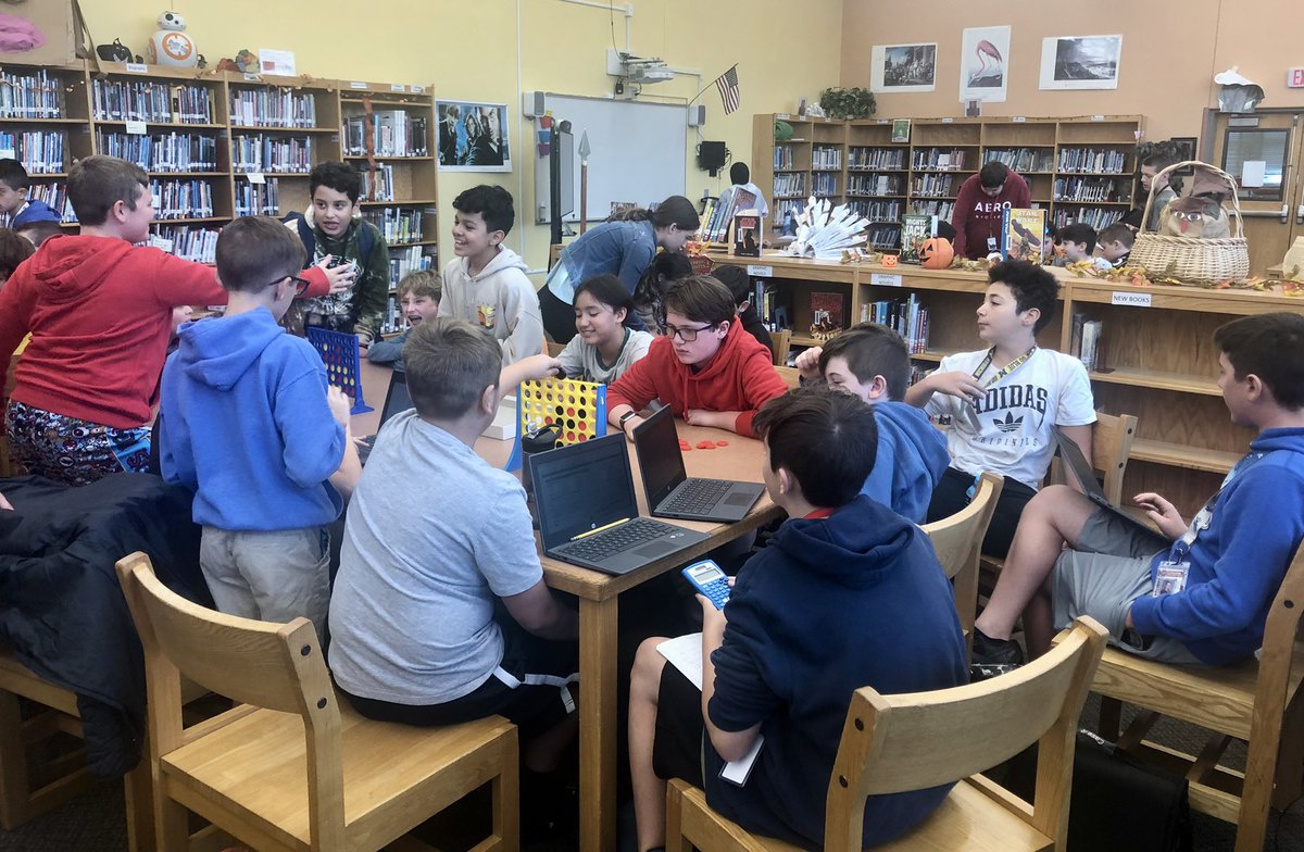 PlainedgeMSLMC's tweet photo. Serious Connect 4 tournament during 7th grade lunch period in the library. Organized by students and so much interest. We will be adding additional boards this year. One of my favorites as a kid and still a big hit! Serious business! #librarylunchperiod #connect4 #itsYOURlibrary https://t.co/2Nw25DaIJ7