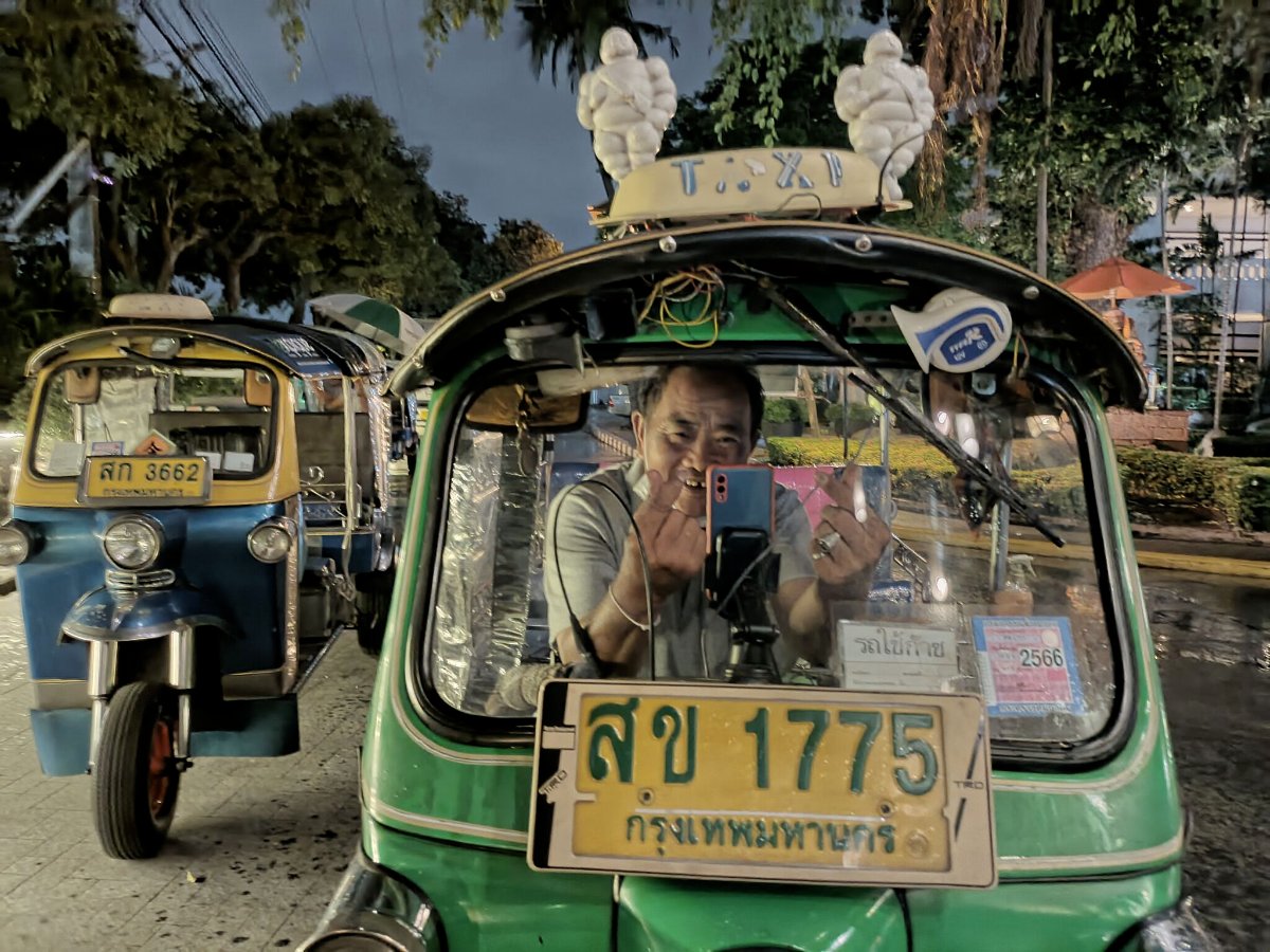 expique's tweet image. When taking a photo, Thais love to make a little heart by crossing their thumb and index finger. Here is Mr Eakassit sending you some love from his tuk tuk. ♥️🛺👍
#tuktukdriver #sendinglove