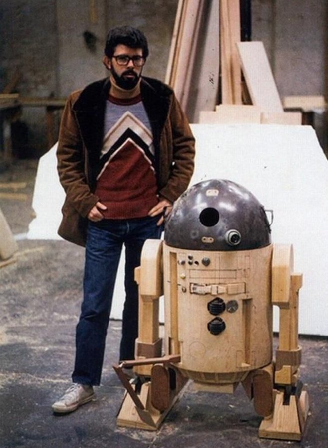 George Lucas and an early version of R2-D2 on the STAR WARS set.