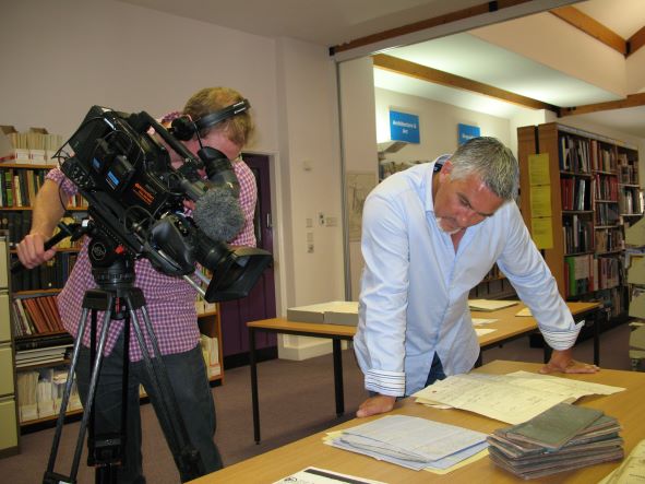 CumbriaArchives's tweet photo. Reminiscing about the time Paul Hollywood visited #WhitehavenArchives for a TV show back in 2013.  He looks fascinated by our documents! #EYAThrowback @explorearchives https://t.co/Xl2z098Ybk