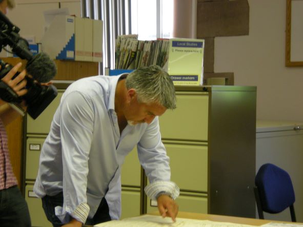 CumbriaArchives's tweet photo. Reminiscing about the time Paul Hollywood visited #WhitehavenArchives for a TV show back in 2013.  He looks fascinated by our documents! #EYAThrowback @explorearchives https://t.co/Xl2z098Ybk