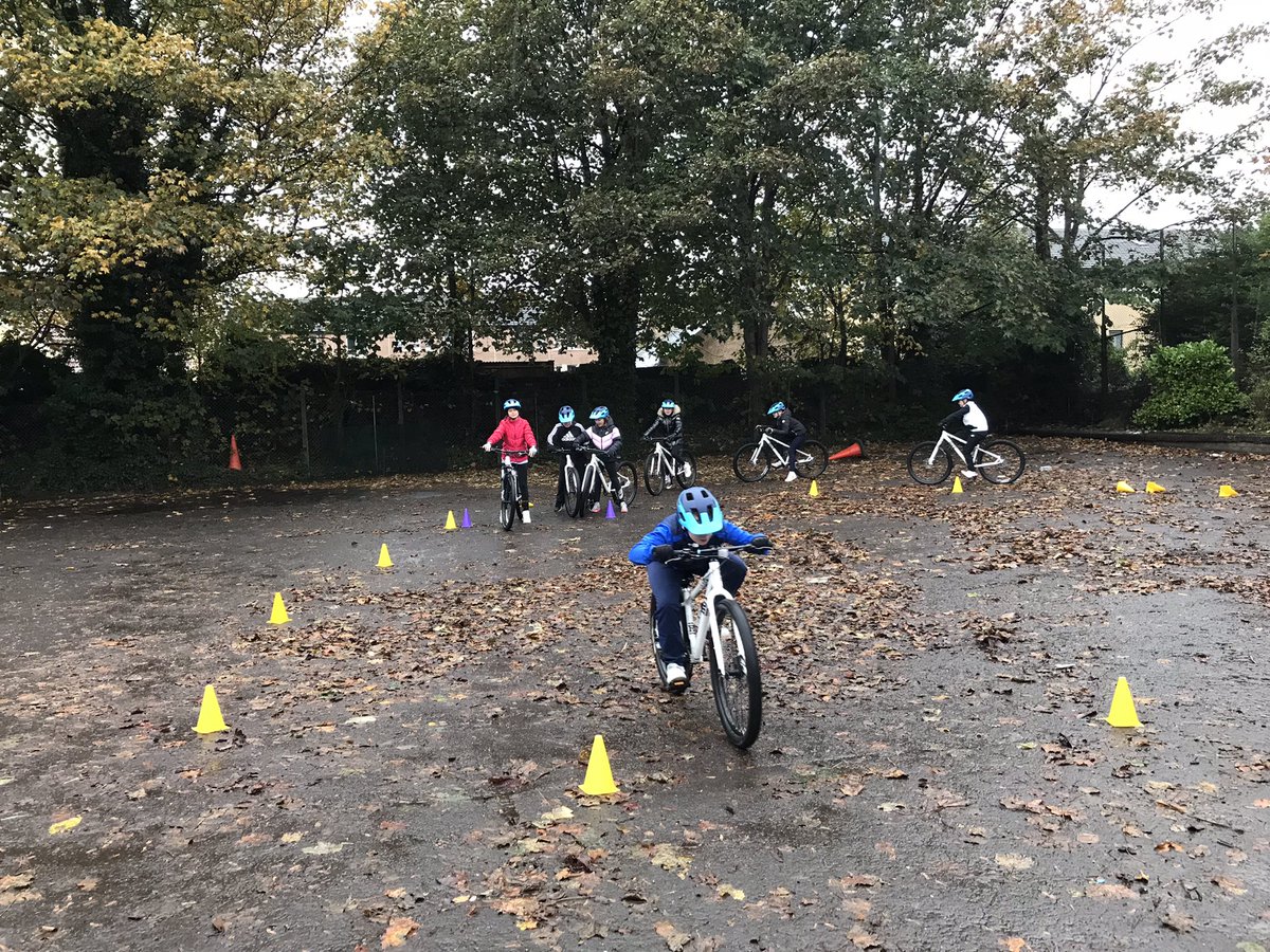 GoRideGlasgow's tweet photo. The young crew at St Paul’s Primary making the best of a very wet day in Glasgow. Unlike the cameraman! 😂@GoRideGlasgow @AchieveMoreSCT https://t.co/bBK8VLWPR3