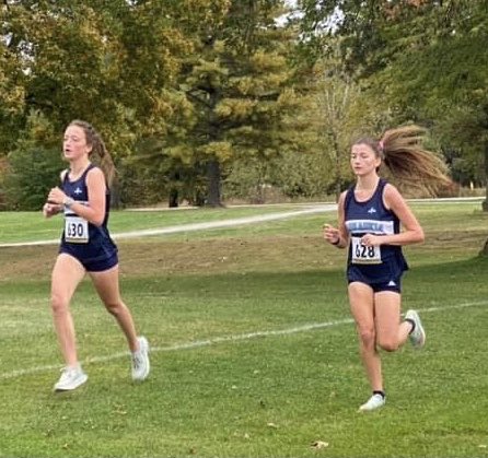 xc_mhargis's tweet photo. Check the crazy hair in this picture! Chloe and Brooklynn getting it done. #goblueangels. Kaskaskia XC https://t.co/kS6O12hD5Y