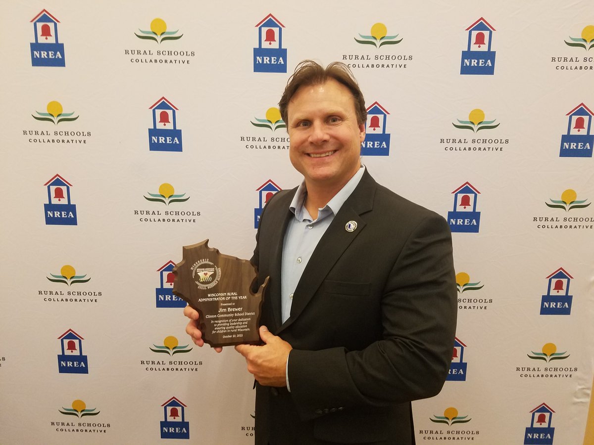 WSPRA's tweet photo. A big congrats to WSPRA Member Dr. Jim Brewer of @clintonwischool who has been named the Rural Administrator of the Year by the WI Rural Schools Alliance, honored at the National Rural Schools Conference in Green Bay this week. #schoolpr #suptchat #RuralEdForum #BeCougarProud https://t.co/e3KK29yV1G