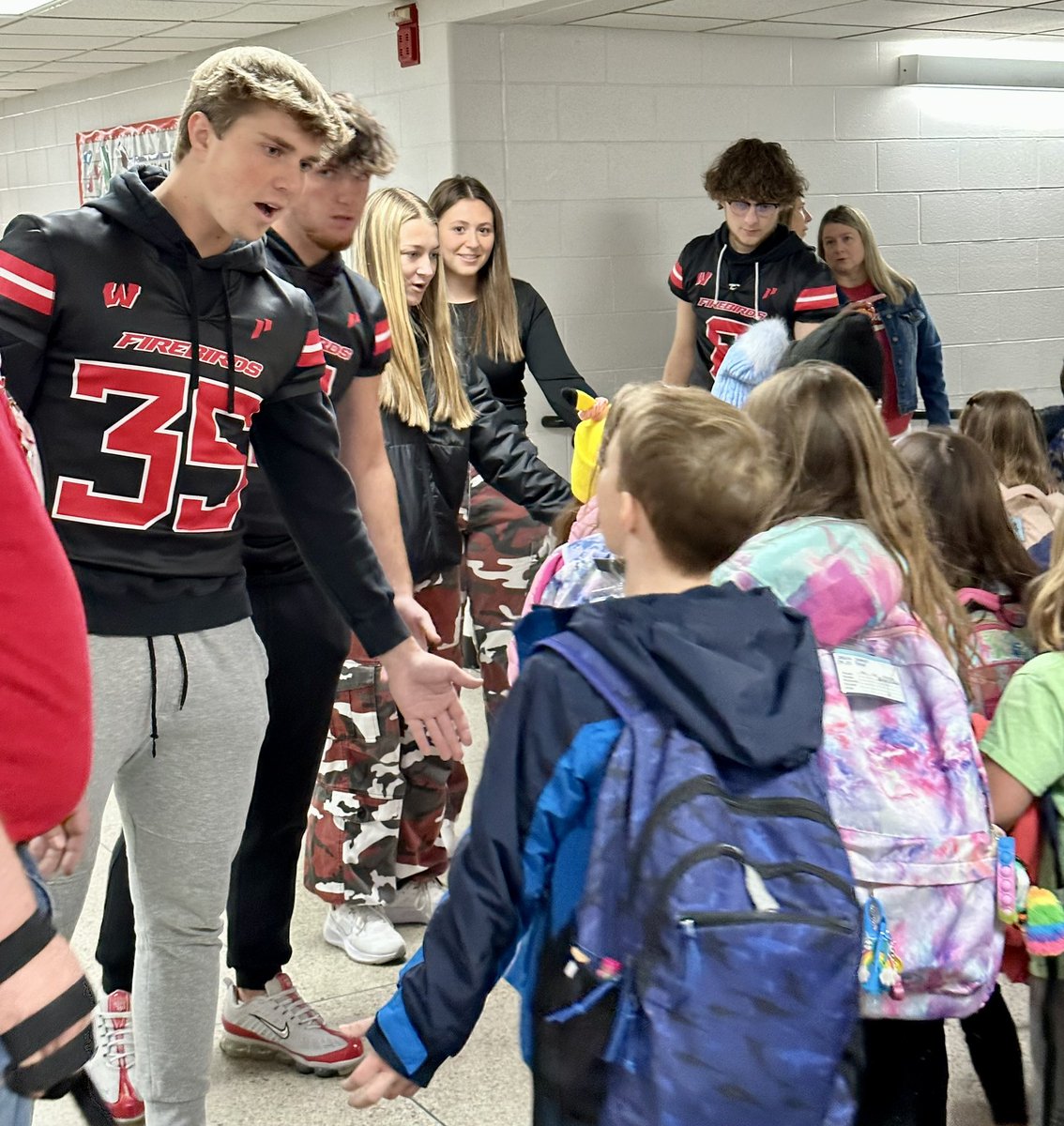 Mrs_NJimenez's tweet photo. We love fanfare days! Thank you to our staff and a group of amazing former @HeritageECS firehawks for helping cheer in our students this morning. #WEchooseLakota #WEareLakota #HECSmagic https://t.co/2BMOFlRxY5