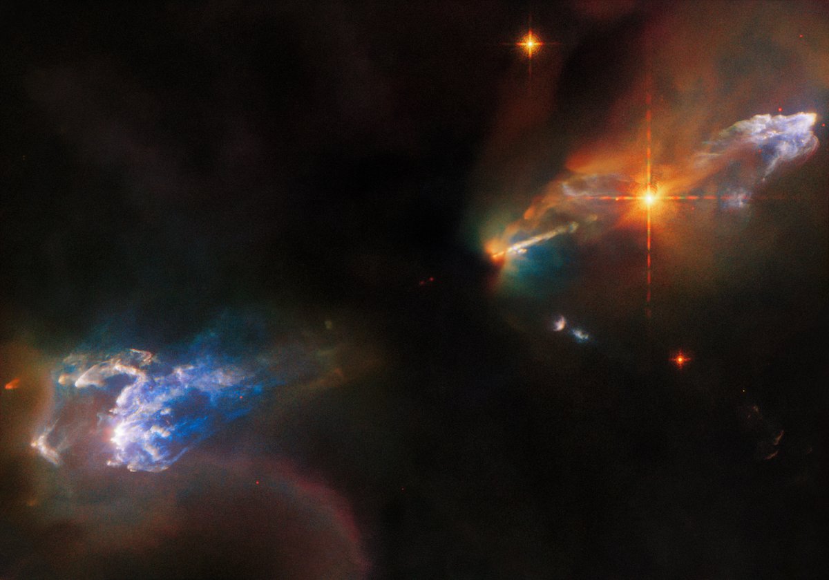 These two cosmic objects bring double trouble for #HubbleFriday! The pair of glowing clumps are Herbig-Haro objects 1,250 light-years away. They were created when jets of gas from newborn stars collided with surrounding gas and dust at breakneck speed: go.nasa.gov/3z1SD2x