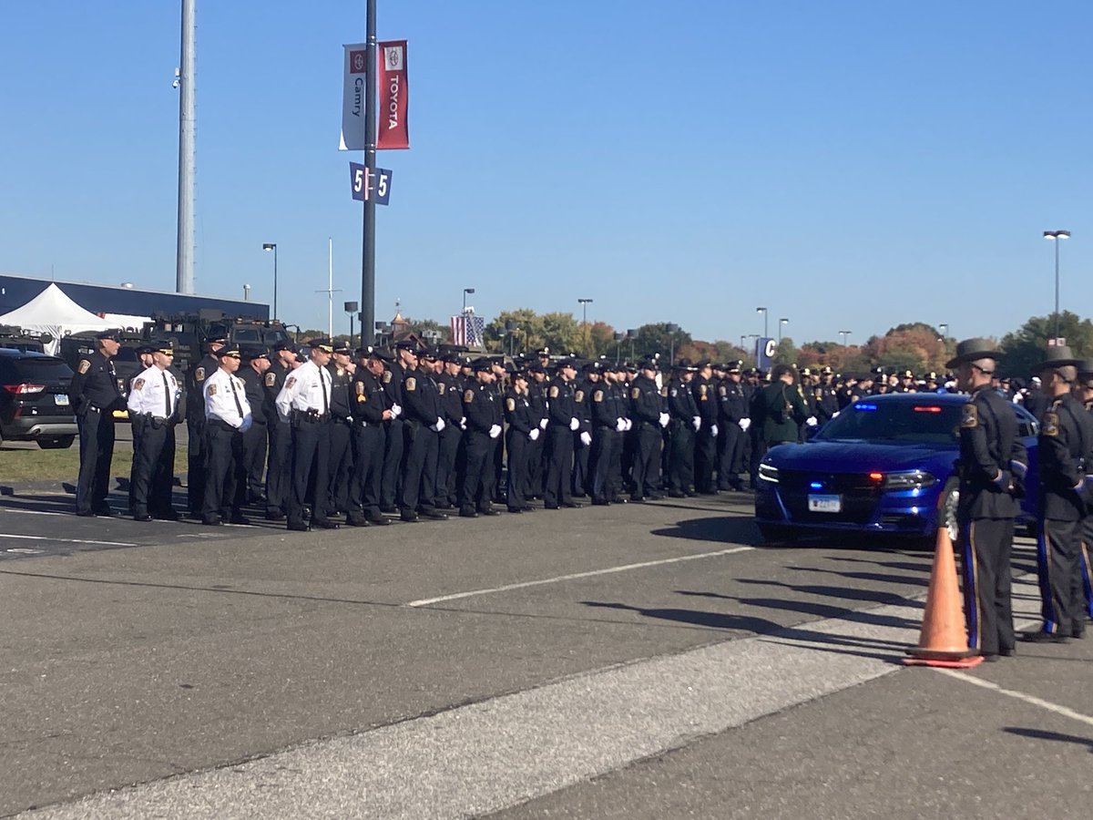 Lines of police await the start of the ceremony. At the start of the first row stands Bristol Chief Brian Gould.