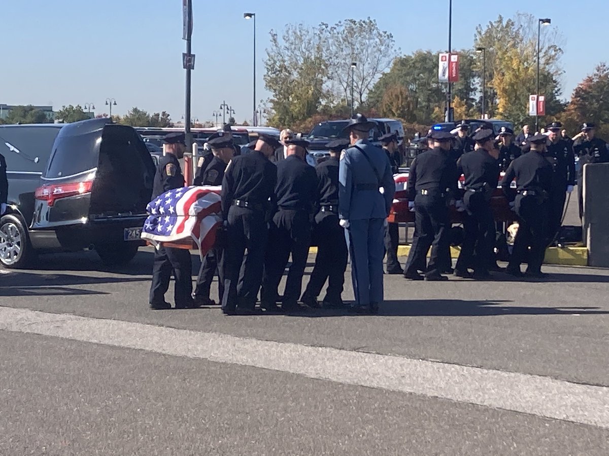 Bristol police carry the coffins of their fallen brothers into Rentschler