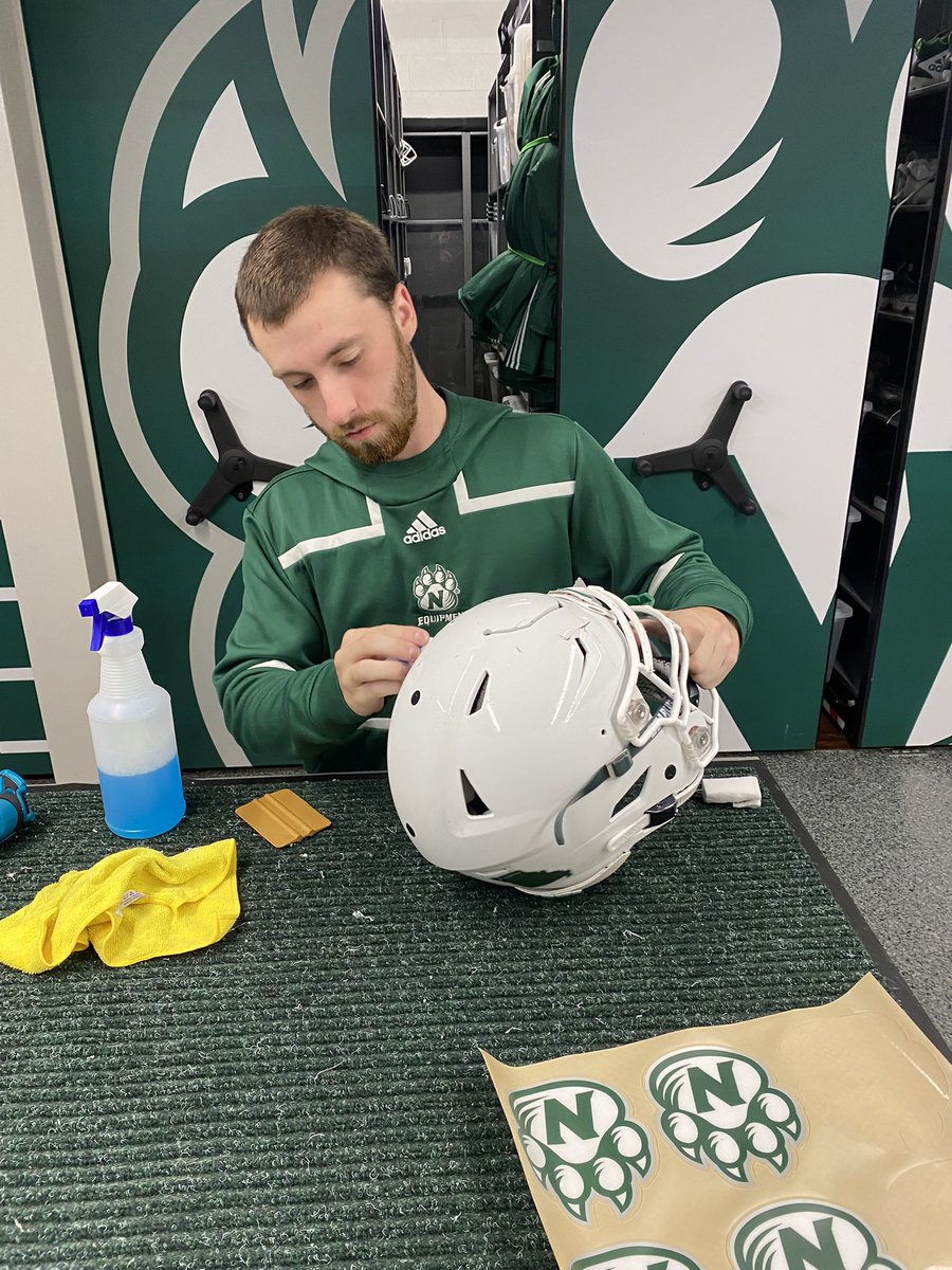 Finishing up the final touches on our game helmets for this week!