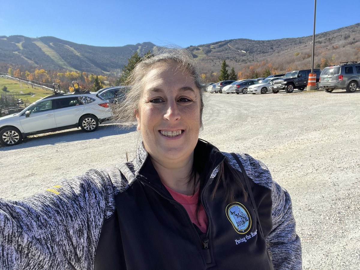 CortniJ's tweet photo. It’s Friday you know what that means…. #mathshirtfriday.  Todays is brought to you from the #atmne2022 conference with an amazing view.  I rocked my atmne pullover and the conference shirt.  #fallinlovewithmath 💕💙 https://t.co/Xy2U2rOtYE