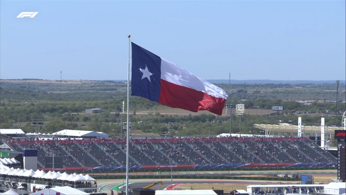 A Texan lone star flag fluttering in the breeze ahead of first practice