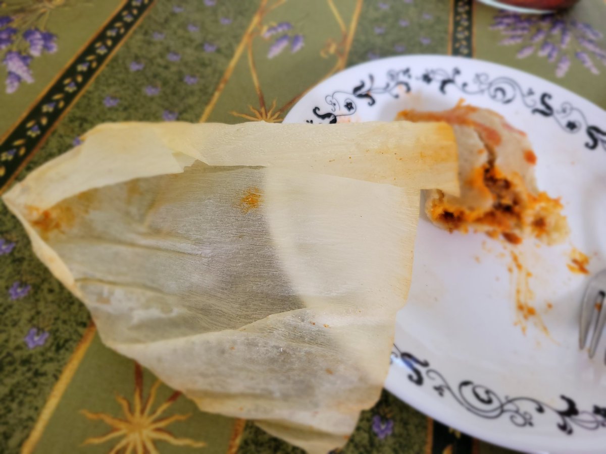 cwpei's tweet photo. Pre-made tamales from Costco now come with "sustainable paper husk" instead of corn husk. So many questions... is it (I assume) really that much cheaper? Or are corn husks hard to get (supply chain)? What happens to the corn husks now? Has the world gone mad? https://t.co/53LLMmqKdu
