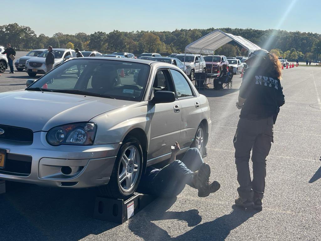 NYPDPBBronx's tweet photo. The NYPD’s ‘Auto Crime Unit’ is at @NYCParks ‘Orchard Beach’ assisting in combating Catalytic converter theft, which is a growing problem nationwide.  They’ve already installed 350+ unique identifying serial numbers.  Thank you everyone for your patience today! 🙏🏽 https://t.co/GuMTCY9i8e