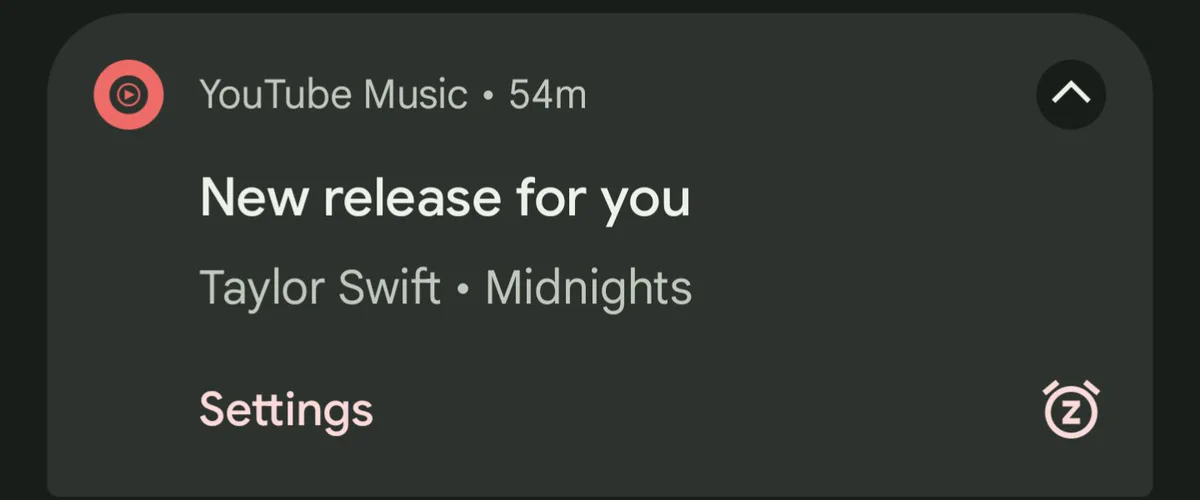 Screenshot of an Android notification from YouTube Music 54 minutes ago stating "New release for you" in bold letters and "Taylor Swift • Midnights" on the following line