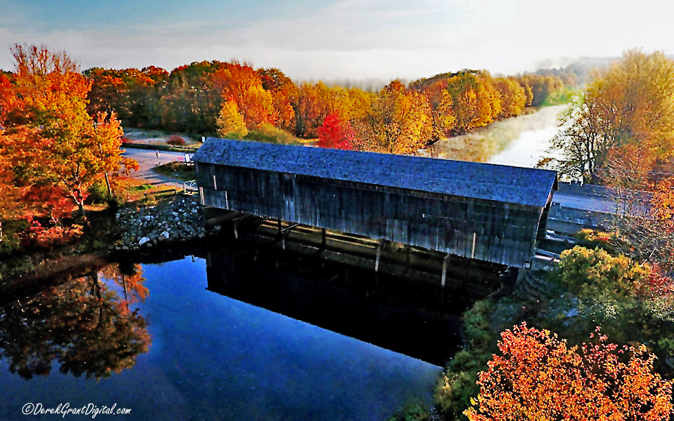 Covered Bridge in #Autumn ~ Aerial drone view of Darlings Island Covered Bridge in Kings County, New Brunswick. No longer open to vehicular traffic, it serves nicely as a walking portal and #architecture study #ThePhotoHour #StormHour #Colourfulfall #AutumnVibes #ExploreNB