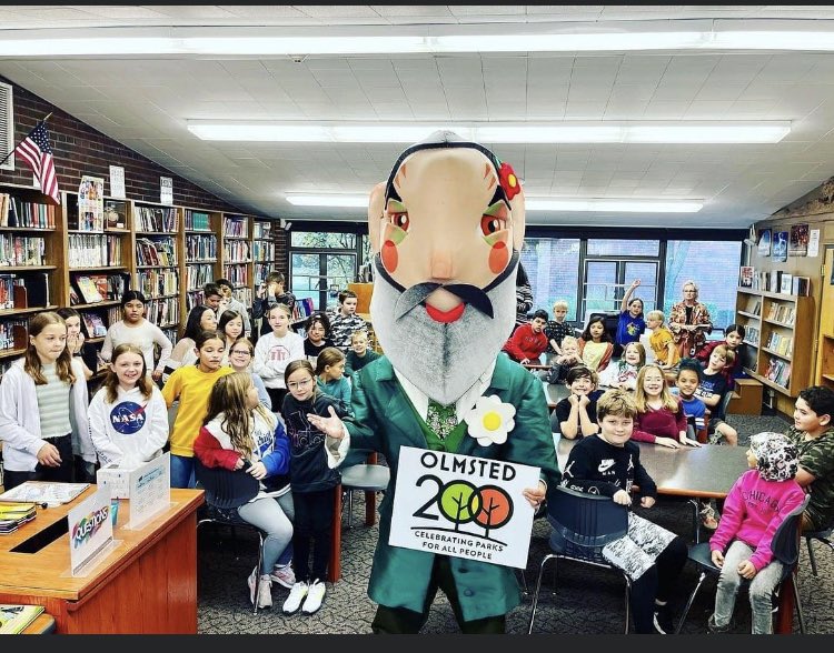chasejohn's tweet photo. How many towns have a giant-headed Frederick Law Olmsted (Big Head Fred) who walks around town teaching kids and adults about the importance of public spaces? https://t.co/kDYahZVN16