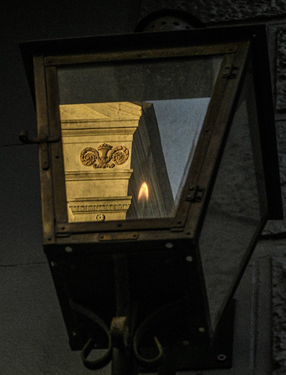 A street lamp reflects Saint Mary's Catholic Church, Chartres street, New Orleans