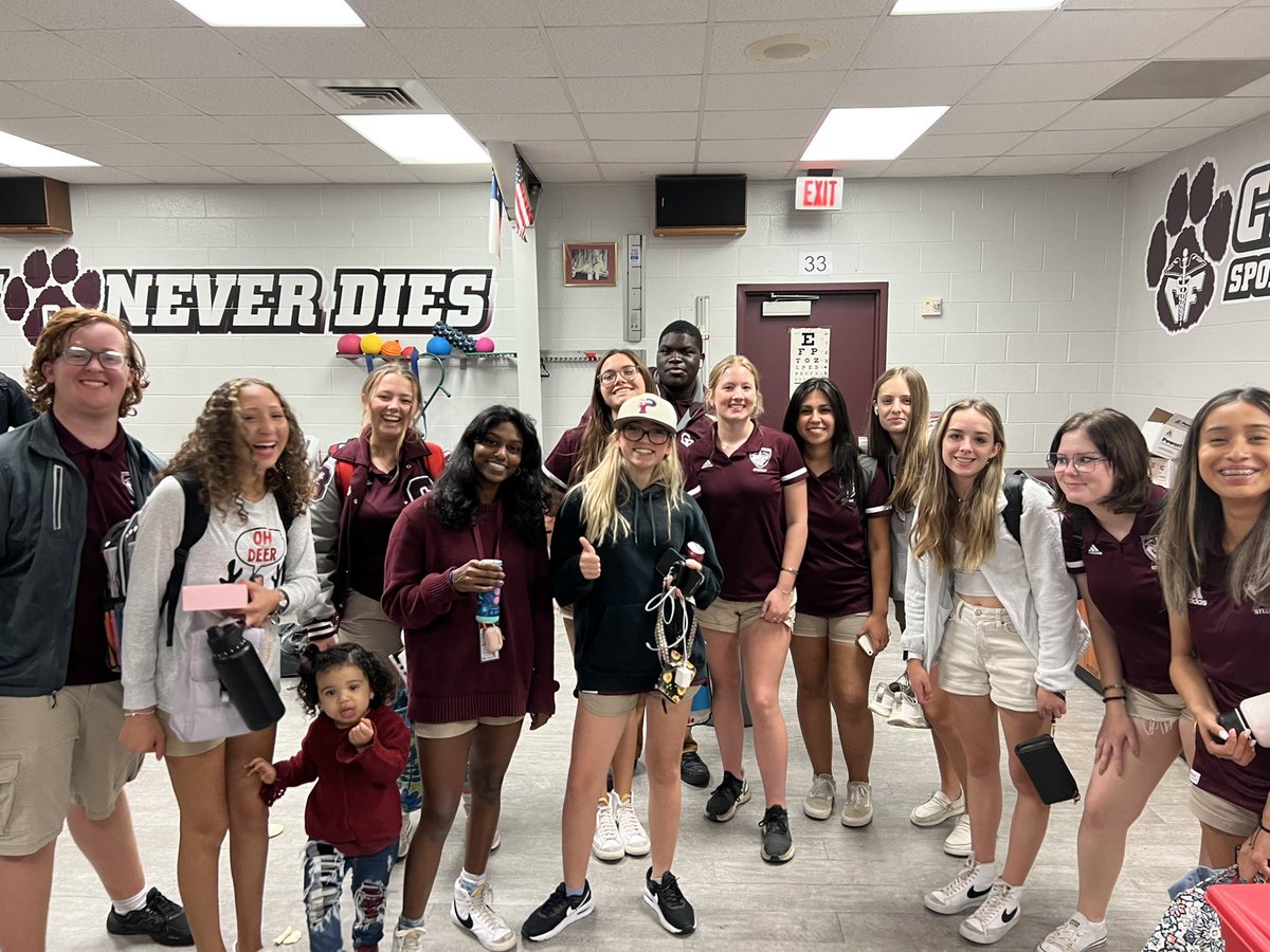 All smiles and laughs after some fun Friday night football for these hard workers! (featuring a photo bombing baby bobcat) #bfnd #teambehindtheteam #FridayNightLights