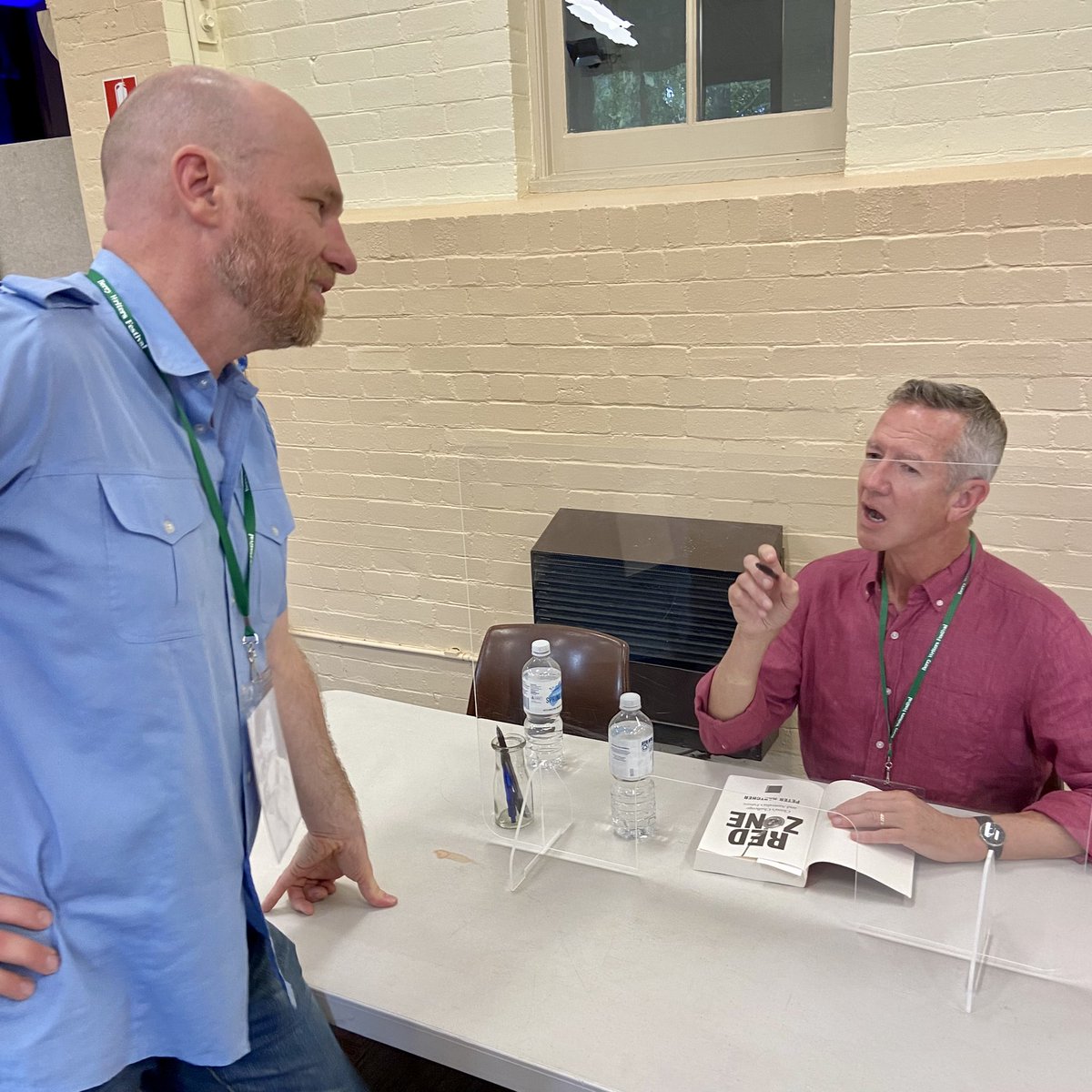 JenergyLight's tweet image. With his panel session “History Lessons” completed this morning, @daviddufty switched to spectator mode at the @BerryWriters Festival. 

Here he is getting his copy of Red Zone signed by @PeterHartcherAO.
Peter talked about important lessons from recent history.