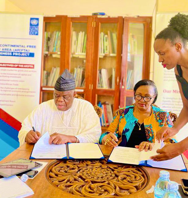 NelsonOcheger's tweet photo. The President of NUCCIMA, Chief Michael Awunor, and President of @UNCCI_UG, Ms Olive Kigongo, signed on behalf of their respective chambers. https://t.co/m6EWKmkXxi