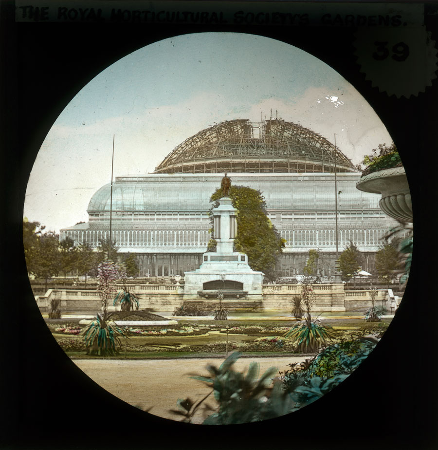 Royal Horticultural Society Libraries (@rhslibraries) on Twitter photo The grand conservatory of the former RHS garden at Kensington.
The <a href="/RoyalAlbertHall/">Royal Albert Hall</a> can be seen being constructed under elaborate scaffolding in the distance.
Hand-coloured lantern slide c.1869, RHS Lindley Library collection. The grand conservatory of the former RHS garden at Kensington.
The <a href="/RoyalAlbertHall/">Royal Albert Hall</a> can be seen being constructed under elaborate scaffolding in the distance.
Hand-coloured lantern slide c.1869, RHS Lindley Library collection.