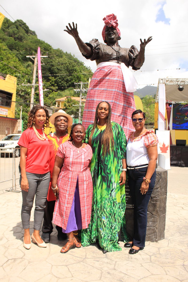 festivallbc's tweet photo. Chair of the @festivallbc Prof @OpalPalmerAdisa with specially invited guests & committee members: Roberta Ellis, Vivian Crawford of the @IoJ_jamaica, M.P. @JulietHolness and Marjorie Leydan-Kirton of the @JCDCJamaica by the @BasilWatson7 statue of #MsLou in Gordon Town. #culture https://t.co/JmYZSQ71JV