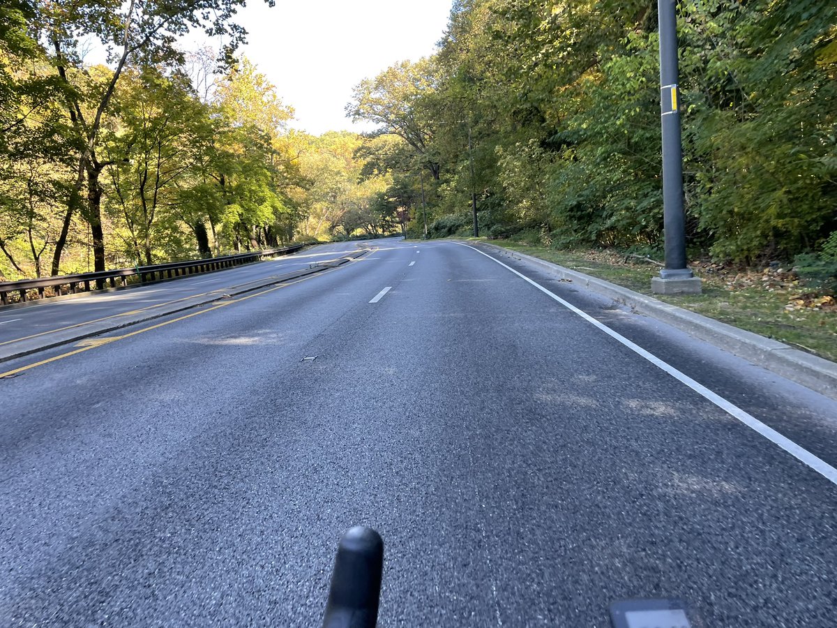 jlivingood's tweet photo. Lincoln Drive with one car lane &amp; protected bike lane would actually be super cool. It was closed today for maintenance - what a pretty road to ride (and contrast from the usual Death Race 2000 on that road)! #lincolndrive #phillycycling https://t.co/GIpzIM442c