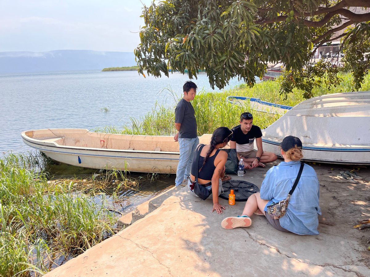 Field team meeting under the old mango tree, talking through ideas in the Mpulungu heat. About as far away from a GPU cluster as you can imagine!
