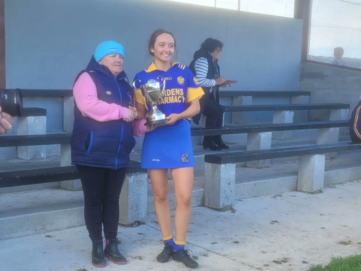 Emma Crowe (she comes from good stock) is delighted to accept the U16A Cup on behalf of her team mates from Brid Mc Namara of <a href="/ClareCamogie/">OfficialClareCamogie</a>