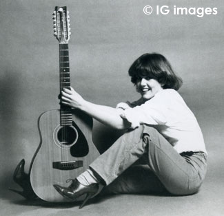 BluesmanMikeF's tweet photo. As many of you know for years I've highlighted images of performers with their 12 string guitars &amp; here's a very special one. The excellent @Invisiblegal Julia Adamson with a fine example seen in her time with Manchester band Blackout. Later to join the Fall of course.. #KeepIt12 https://t.co/zOmKuIhqns