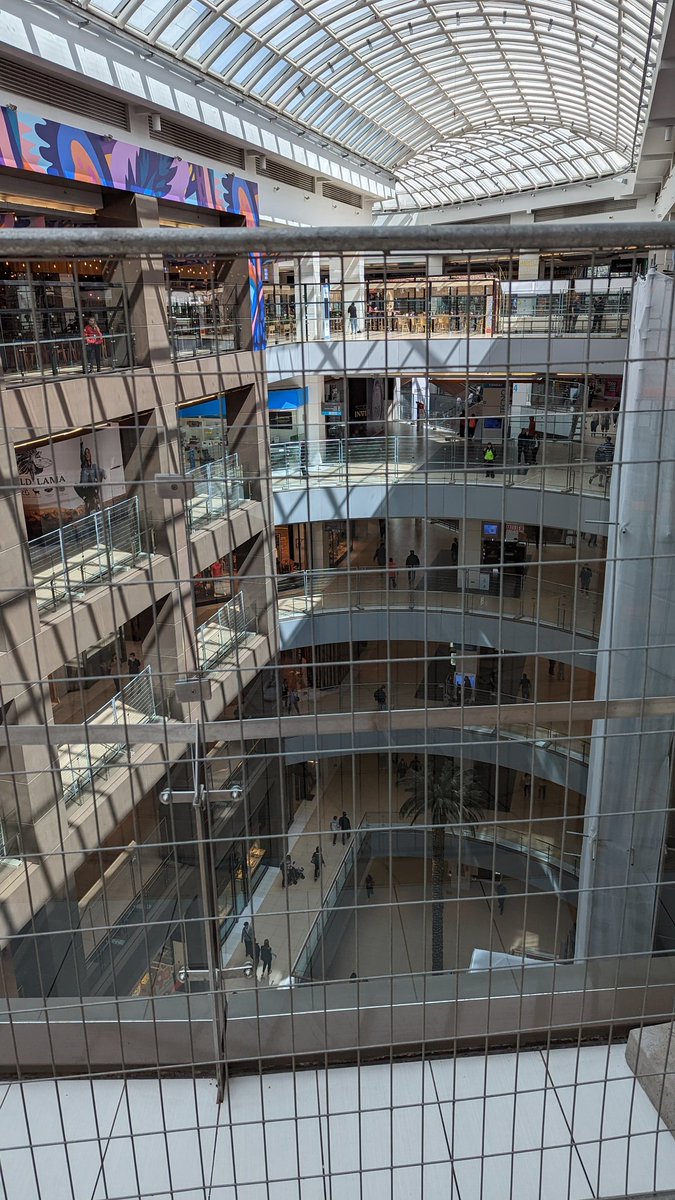 BorisvanderSpek's tweet photo. In Chile's biggest mall, Costanera Center in Santiago, these fences were placed after every year, a number of people jumped to their death here. Another happy face of neoliberalism. https://t.co/E2KqFsRXfx
