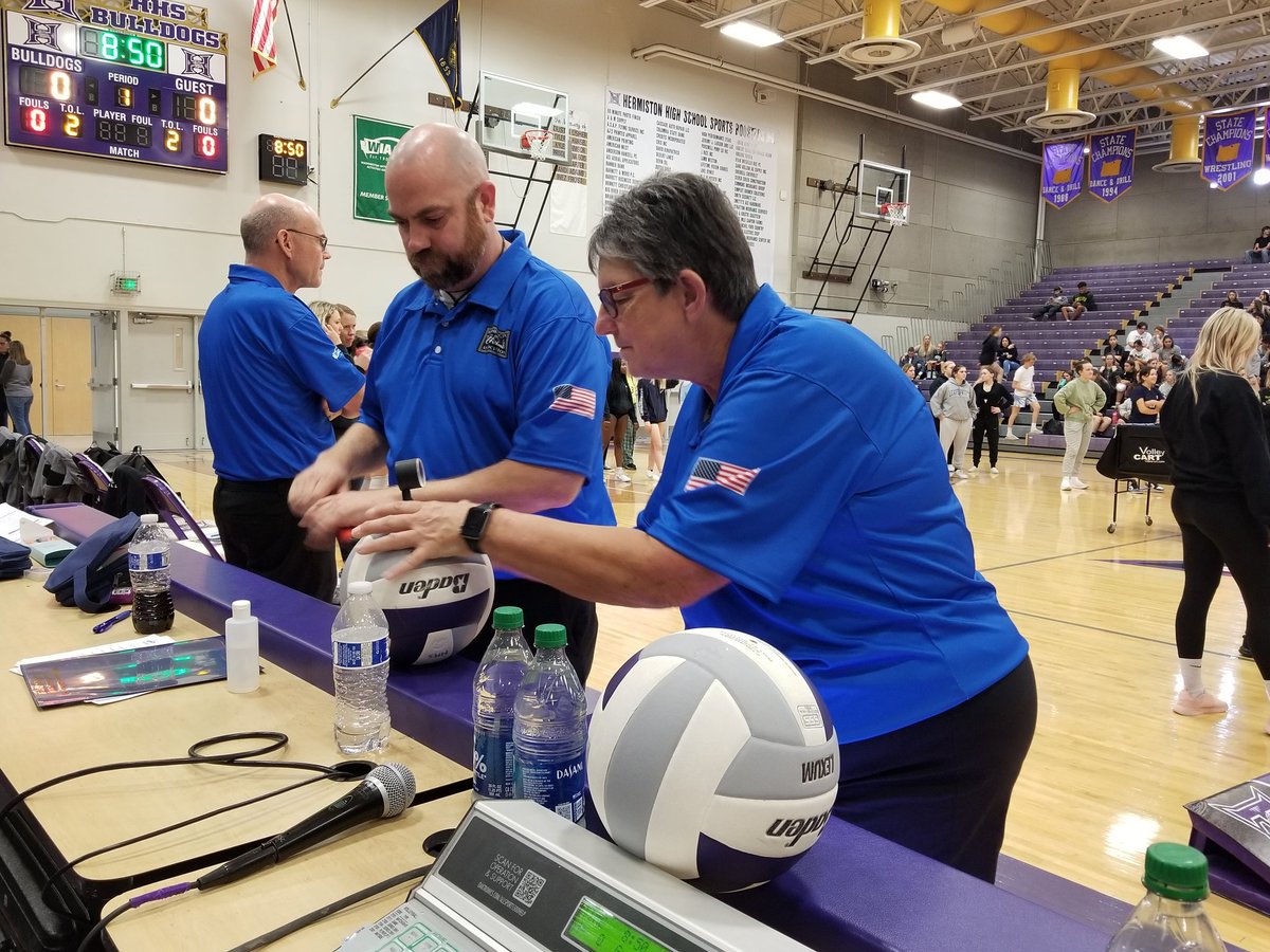 The <a href="/wiaawa/">WIAA</a> officials checking the air pressure in the volleyballs before the <a href="/DAWG_athletics/">Hermiston Athletics</a> and <a href="/Southridge_Suns/">Southridge Athletics</a> match.