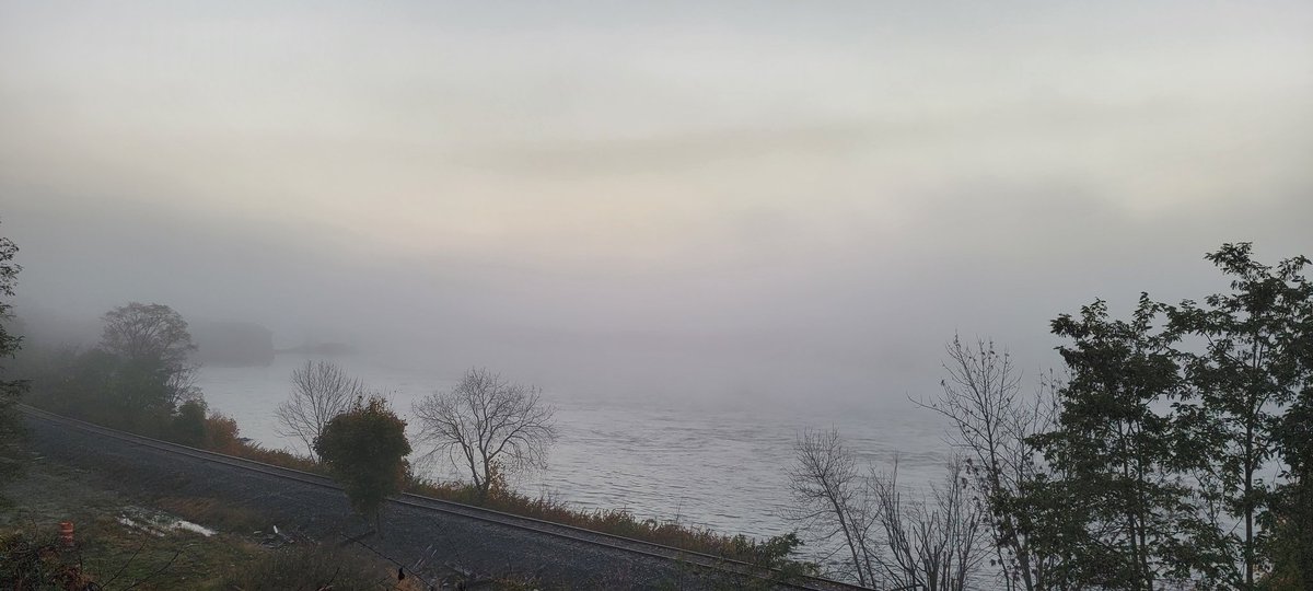 GSn04401's tweet photo. @petermarteka What a shot! Man did you ever catch better lighting for a "smoke on the water shot" than I did this morning. LOL The Penobscot is down there...flowing full tilt too. If you squint you might see it!! #sockedin https://t.co/br4s1COUas