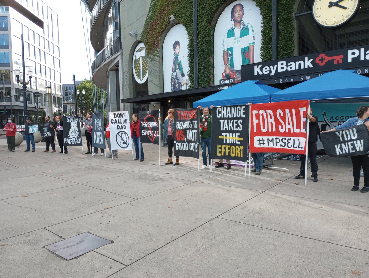 SCANPTFC's tweet photo. Rally today outside Providence Park to call for new ownership of Portland Thorns/Timbers. Tomorrow we ask everyone to take part in @PDXRivetersSG rally at 11:30am to welcome players. #MPSell #CutTheRot https://t.co/QSLyVgVT8m
