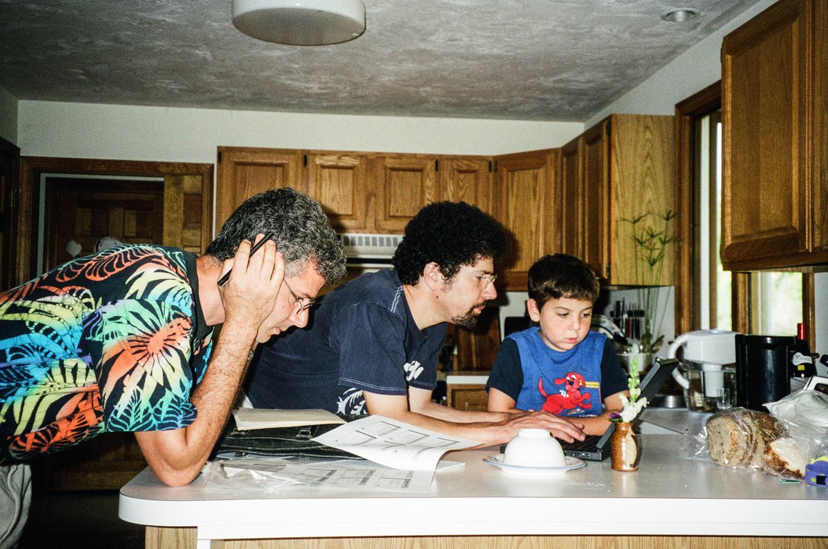 Here's a picture of me working on the first Effective Java talk after the book was released at JavaOne (2001). I'm at my sister's house in Acton, MA, with brother Dan and son Tim. The talk was at Softpro Books in Burlington. My dad took the picture.