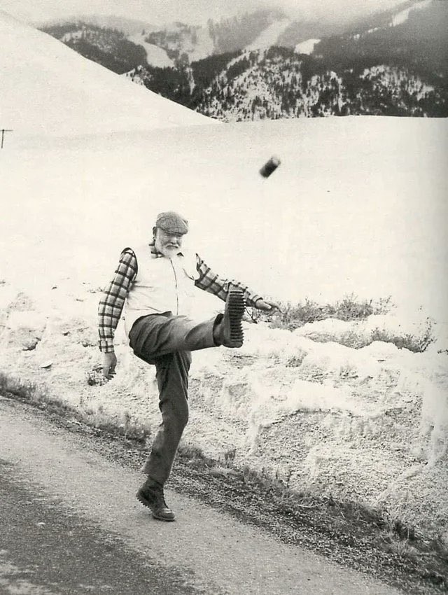 Ernest Hemingway kicking a can of beer. Ketchum, Idaho, 1959.