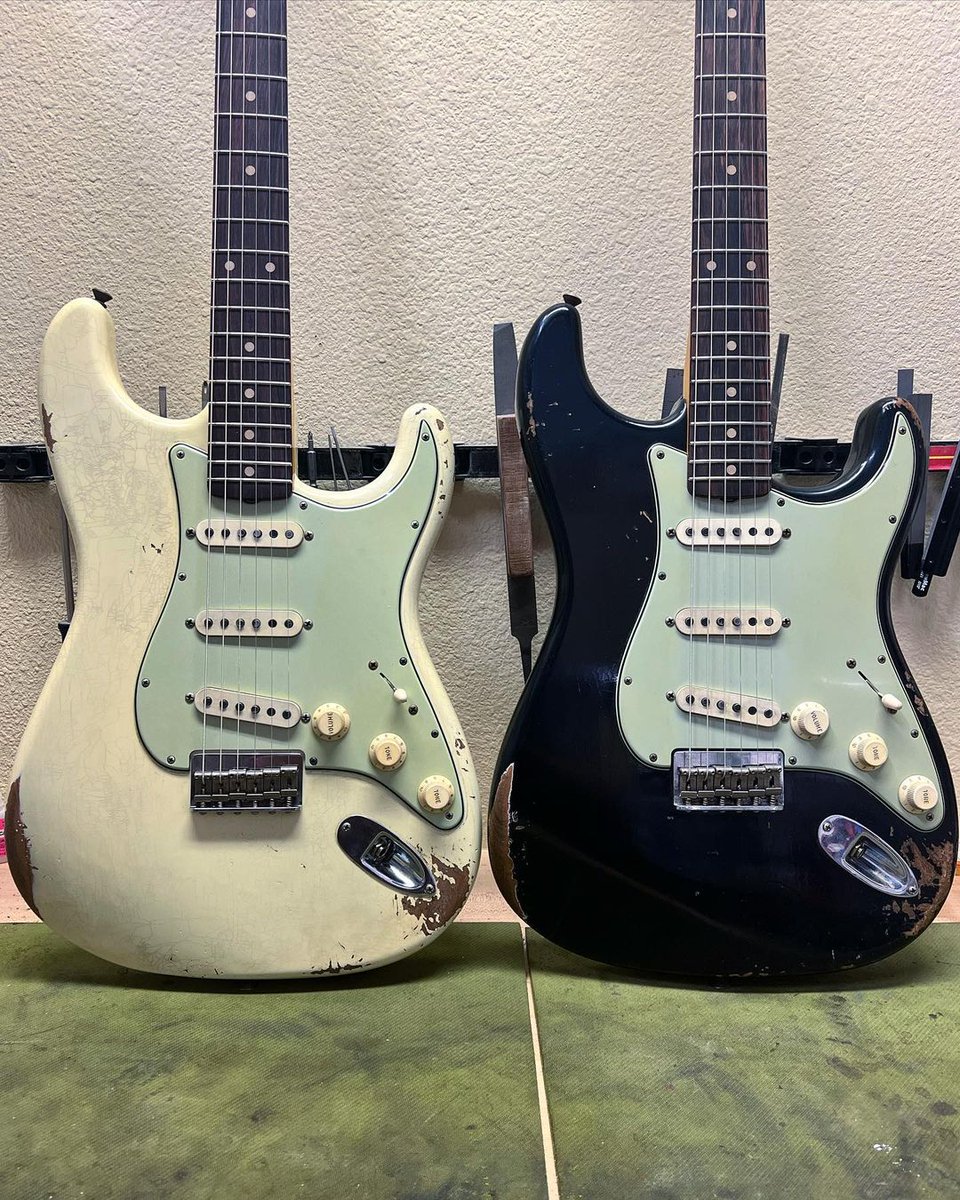 Fender's tweet photo. Celebrate #Straturday with this pair by Andy Hicks! These Vintage Black and White Strats feature a 7.25” radius with vintage upgrade frets, brazilian rosewood fingerboards and quartersawn maple necks. https://t.co/4JENg6r8J4