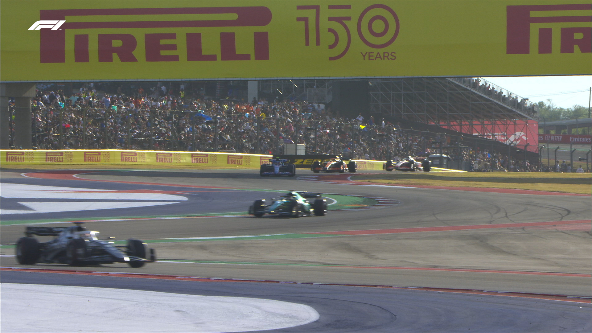 A wide angle shot of the first sector in Austin, with five cars easily seen in shot in the final moments of Q1