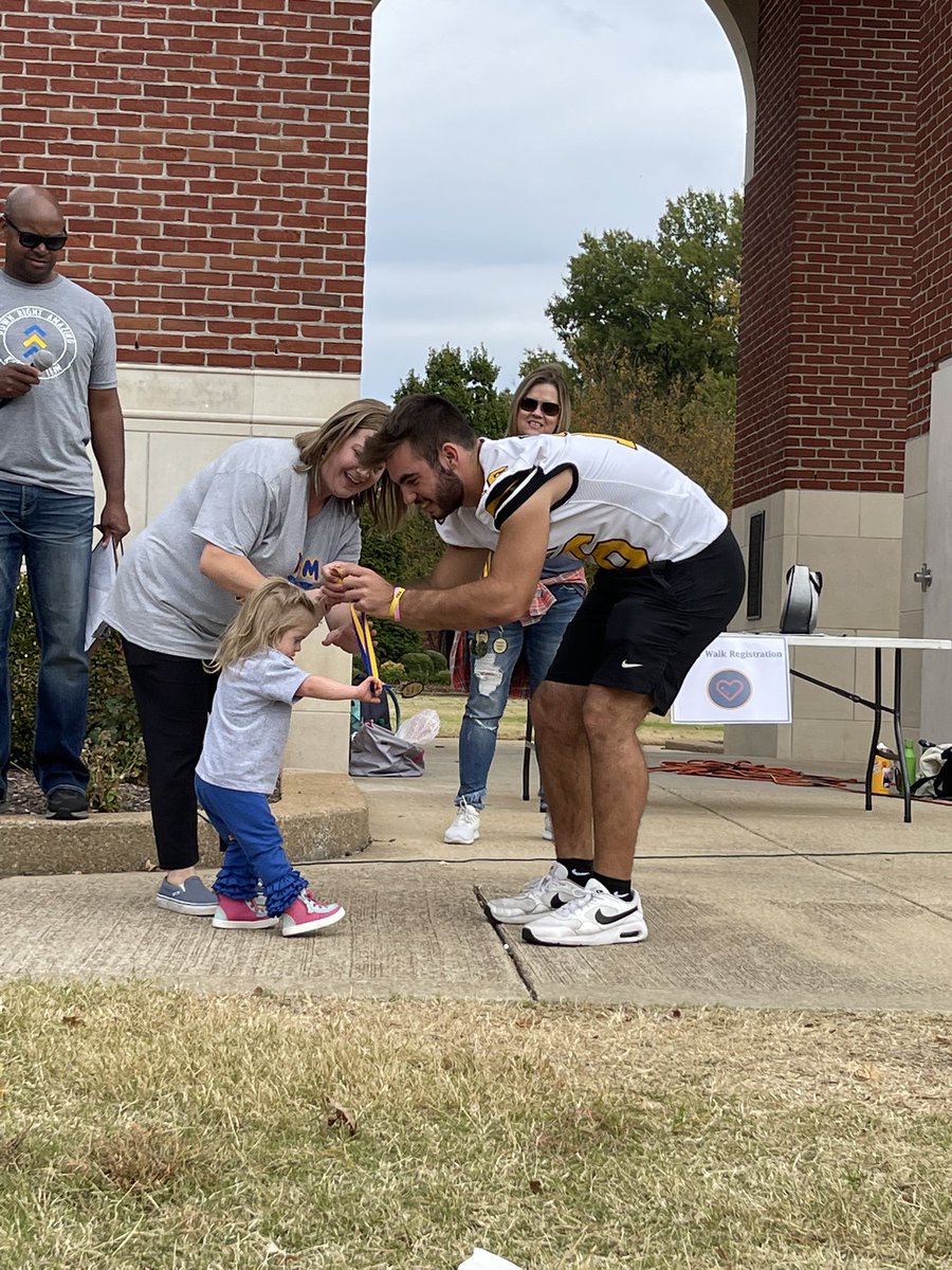 driggers_brooke's tweet photo. After a tough loss last night, this kid got out of bed and volunteered at the Jackson Buddy Walk today. Sambo, we are so proud of you! Just look at those smiles!! 💙💛 @JasonDriggers82 @SamDriggers12 https://t.co/aokzxNwLdy