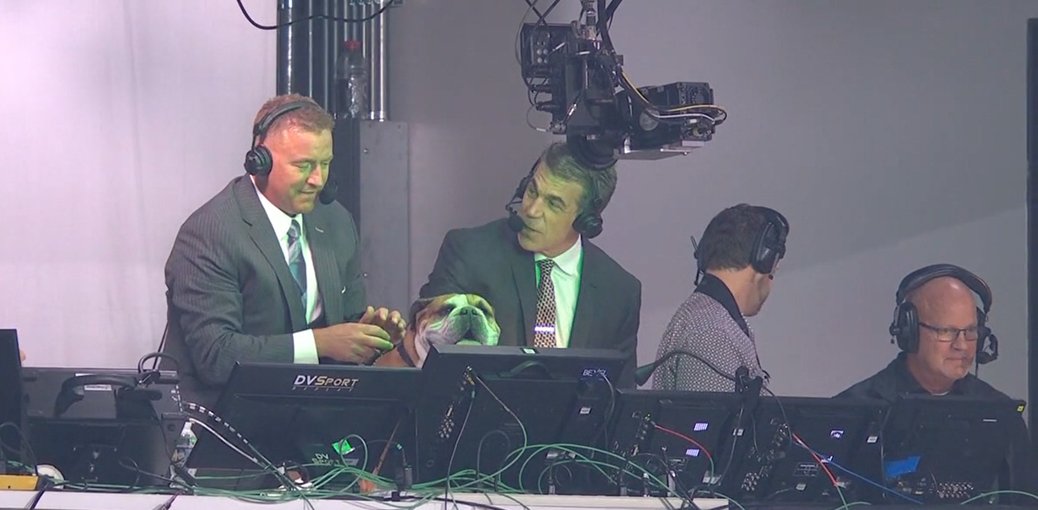 bhofheimer_espn's tweet photo. .@KirkHerbstreit is all about dogs. He and @cbfowler welcome @HailState mascot @BullyXXI up to the ESPN booth during #MSSTvsBAMA. 🐶 https://t.co/zAPZYIDQE3