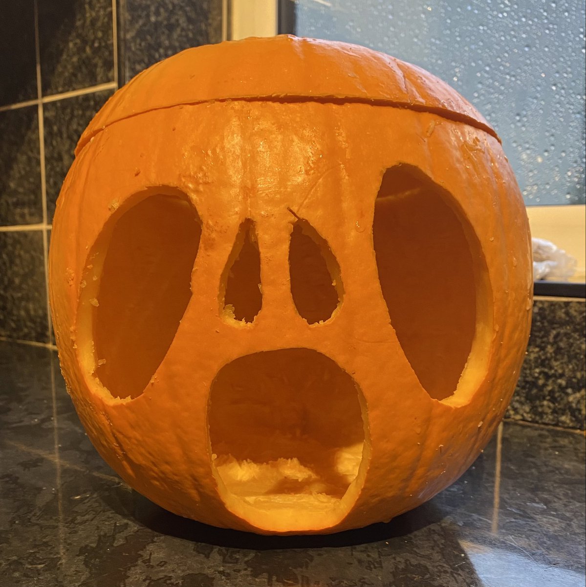 Torrential rain here today so Nye decided to carve his pumpkin… he was really pleased with his efforts 🎃