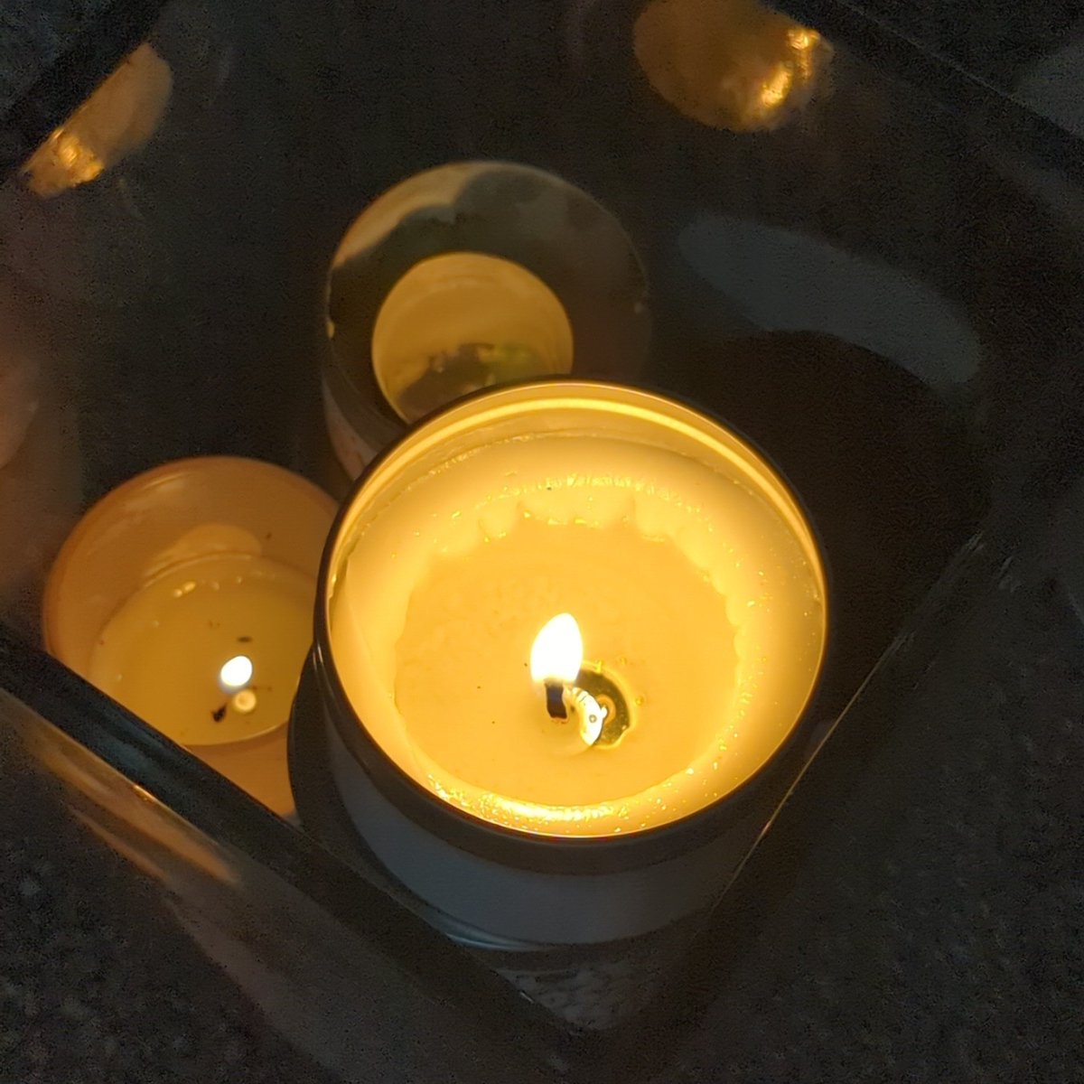 I sit, cocooned in fleecy blanket &amp; robe, in my favourite window seat. The rain pours in constant cadence, soothing &amp; soporific, accompanied by flickering candle light, bright &amp; warming in the darkness of the day. A car splashes by occasionally, a sound of childhood.