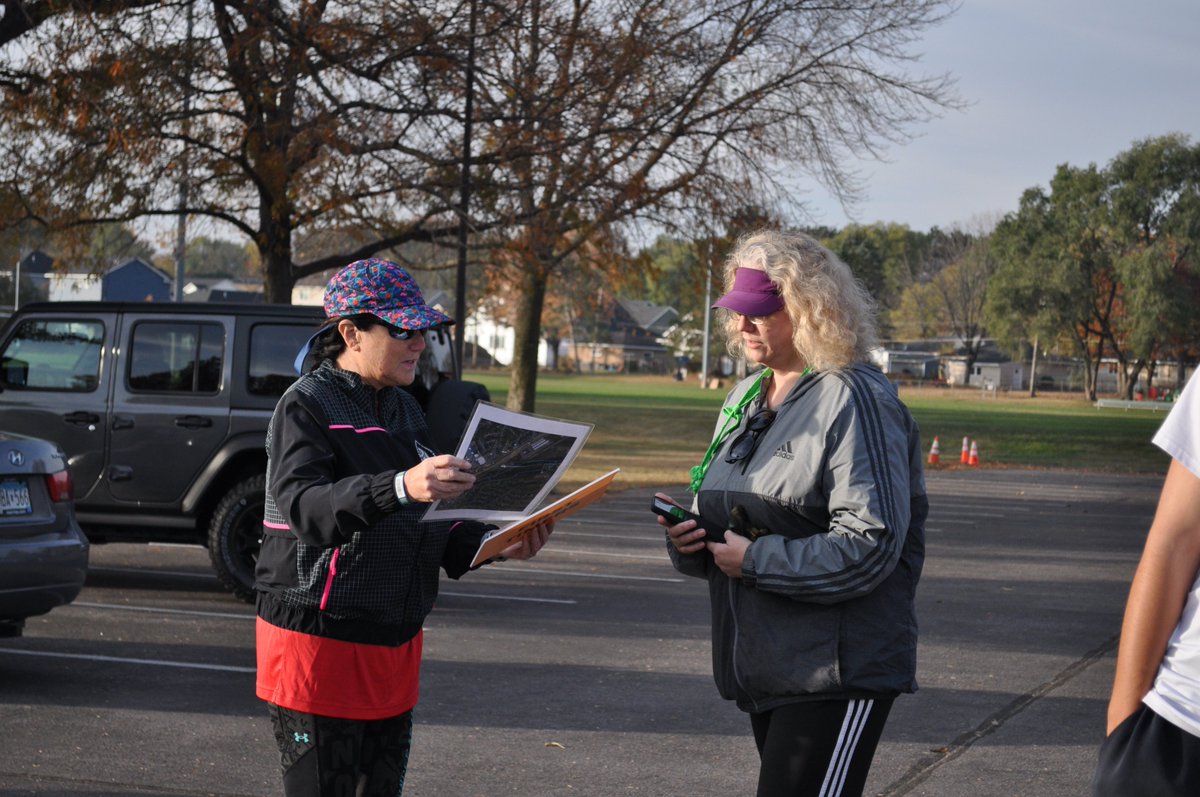 Ali greeting and briefing First Timer Karen at Hamlet Park parkrun #24.  Welcome, Karen!
