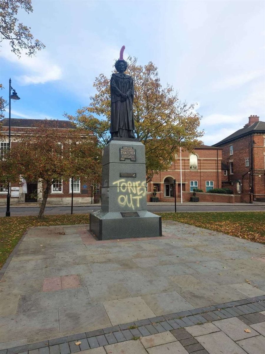 🚨 | BREAKING: Sick pranksters have added further insult to injury last night by placing a giant novelty dildo on top of the already vandalised statue of Baroness Thatcher.